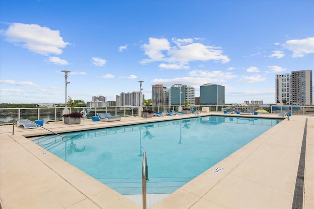 view of swimming pool featuring a patio