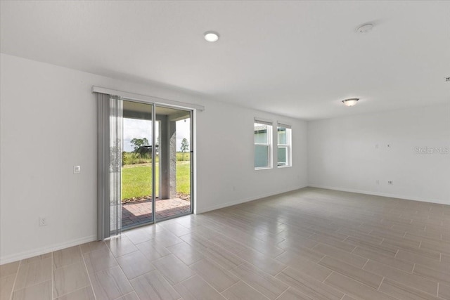 spare room featuring a wealth of natural light