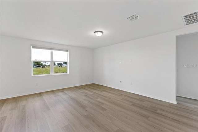 empty room with light wood-type flooring