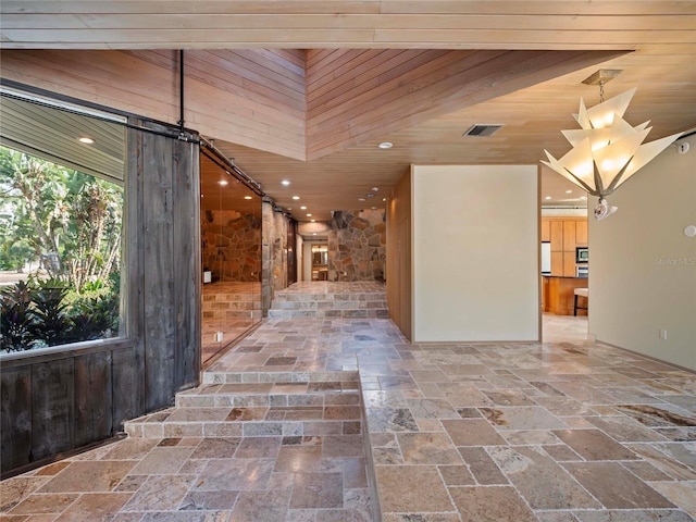 corridor featuring wood walls and wood ceiling