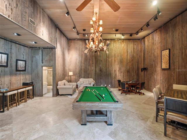 recreation room featuring wooden ceiling, billiards, track lighting, ceiling fan with notable chandelier, and wood walls