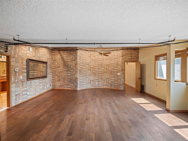 interior space with ceiling fan and hardwood / wood-style floors