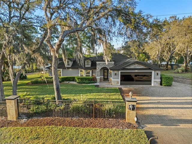 view of front of home with a garage and a front yard