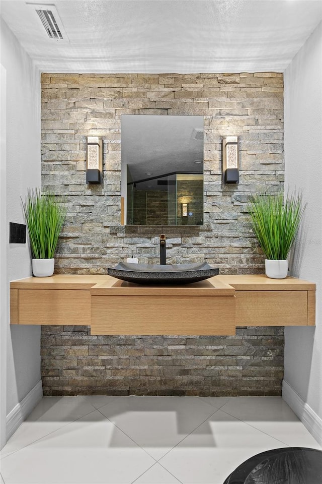 bathroom with sink and tile patterned floors