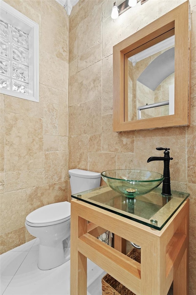 bathroom featuring tile walls, vanity, tasteful backsplash, and toilet