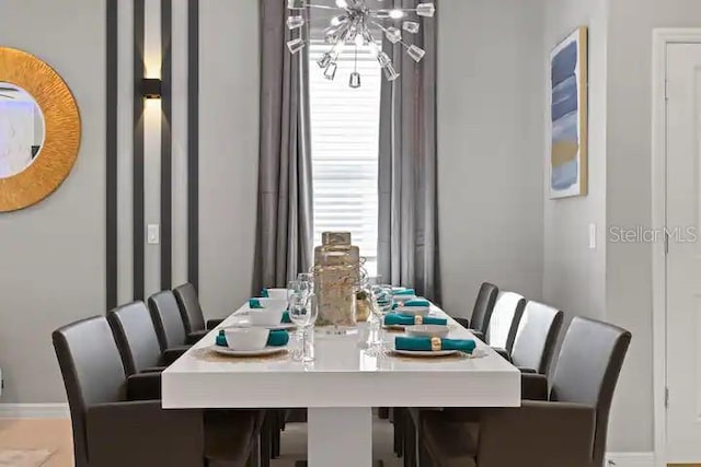 dining space featuring an inviting chandelier