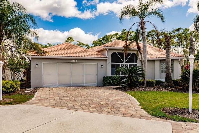 mediterranean / spanish-style house featuring a garage