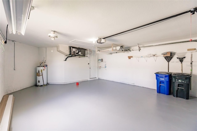 garage featuring a garage door opener and water heater