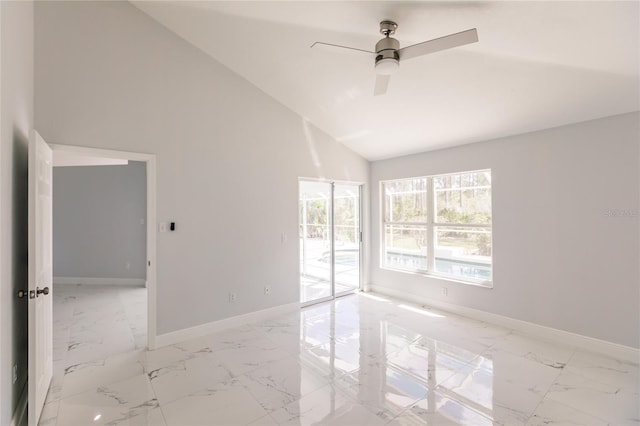 spare room featuring ceiling fan and high vaulted ceiling