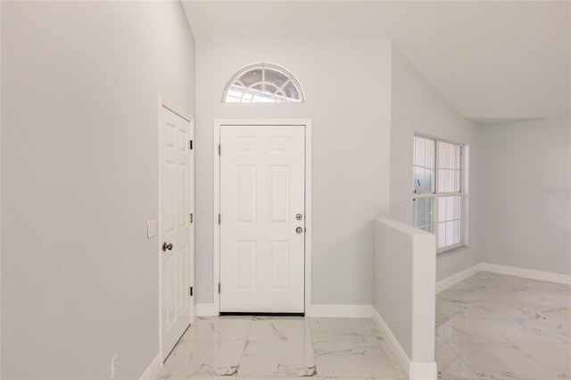 entrance foyer with vaulted ceiling