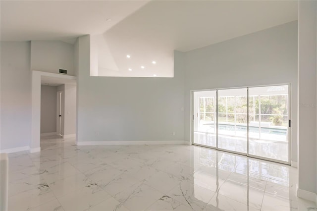 empty room featuring a high ceiling