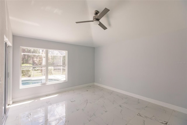 spare room featuring ceiling fan and lofted ceiling