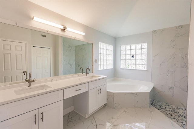 bathroom with vanity and separate shower and tub