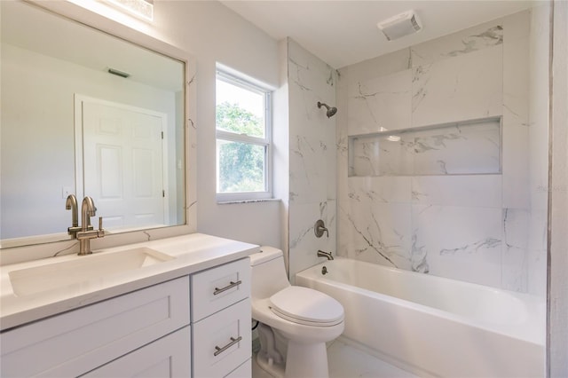 full bathroom featuring vanity, toilet, and tiled shower / bath