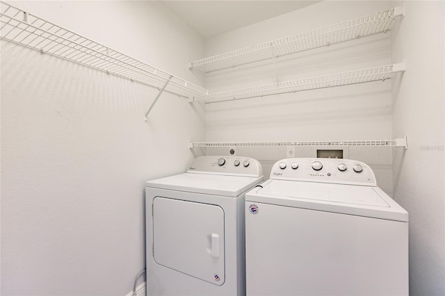 laundry area with washing machine and dryer