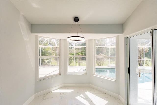 unfurnished dining area featuring a wealth of natural light