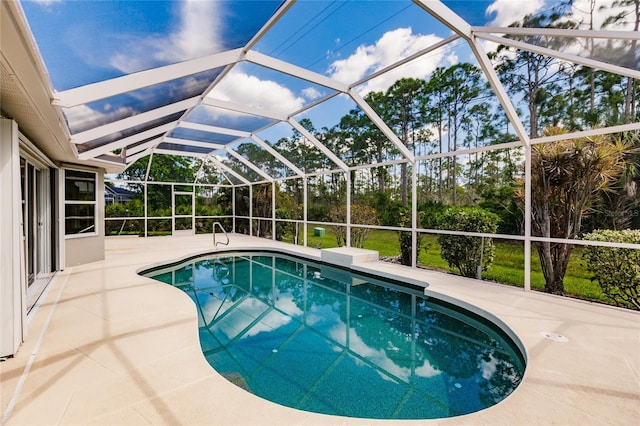 view of pool featuring a lanai and a patio area