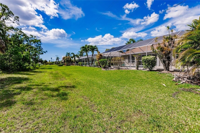 view of yard featuring a lanai