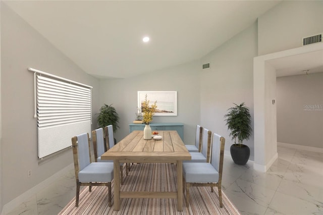 dining area with vaulted ceiling