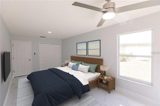 bedroom with ceiling fan and a closet