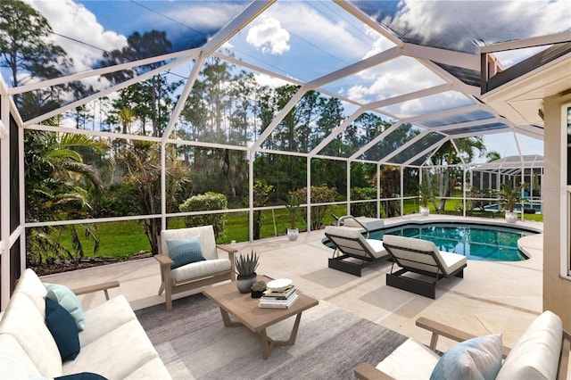 view of pool with a lanai, an outdoor hangout area, and a patio area