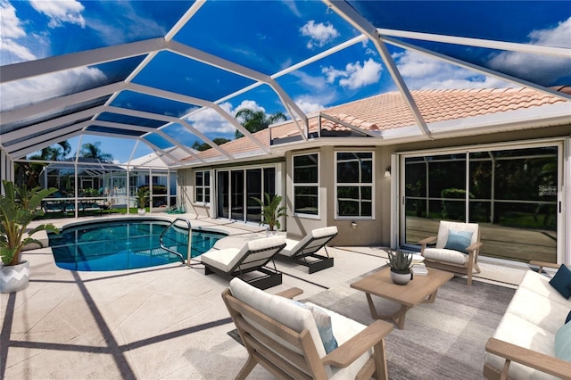 view of pool with a lanai and a patio area