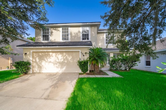 view of front facade featuring a garage and a front lawn