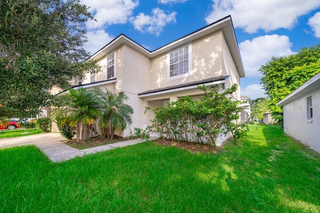 view of front of property with a front lawn