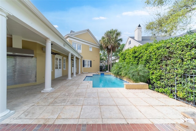 view of swimming pool featuring a patio area