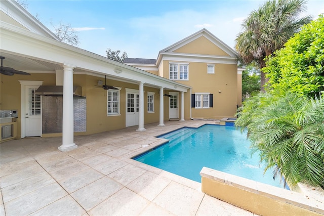 view of pool with ceiling fan and a patio area