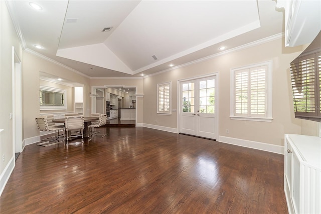 foyer entrance featuring crown molding, dark hardwood / wood-style floors, a tray ceiling, and french doors