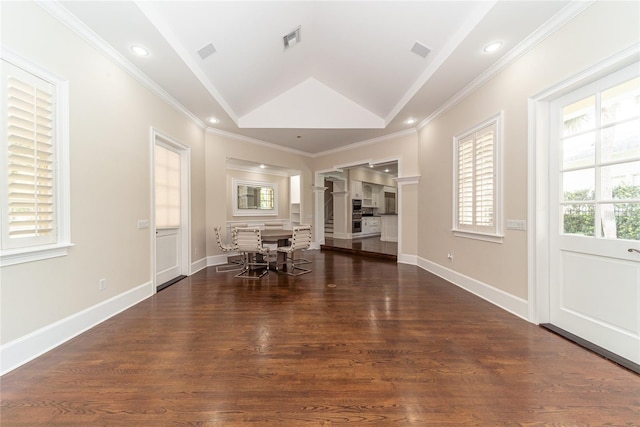 unfurnished living room featuring lofted ceiling, ornamental molding, decorative columns, and dark hardwood / wood-style flooring