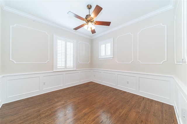 spare room featuring dark hardwood / wood-style floors, ceiling fan, and ornamental molding