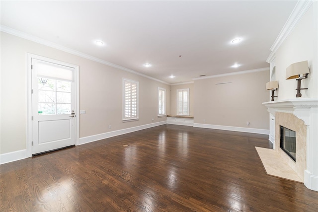 unfurnished living room featuring a premium fireplace, crown molding, and dark hardwood / wood-style flooring