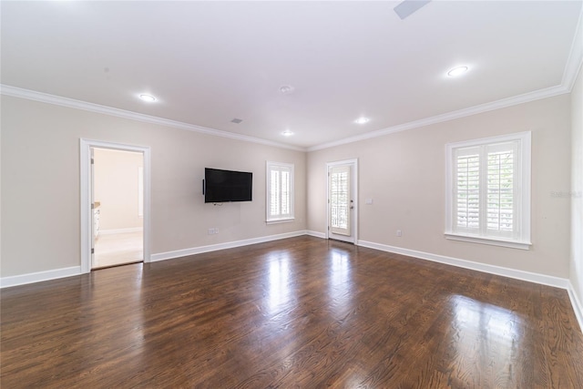 spare room featuring crown molding and dark hardwood / wood-style floors