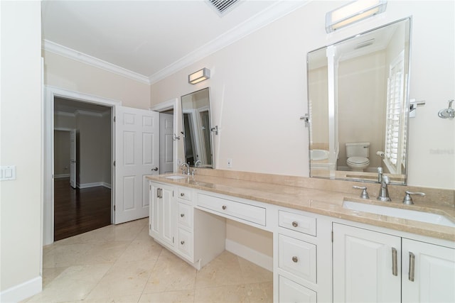 bathroom featuring toilet, hardwood / wood-style flooring, double sink, vanity with extensive cabinet space, and ornamental molding