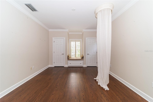 foyer entrance featuring dark wood-type flooring and crown molding