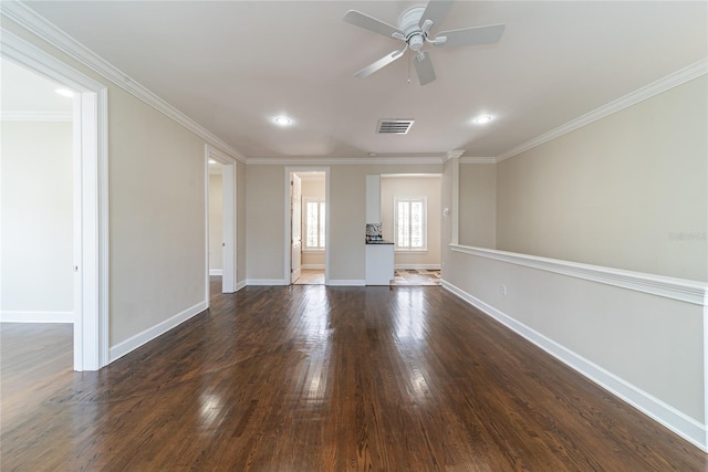 unfurnished living room featuring crown molding, dark hardwood / wood-style floors, and ceiling fan