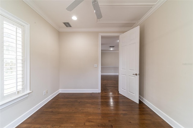 spare room with dark hardwood / wood-style floors, ceiling fan, and ornamental molding