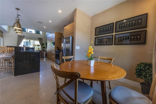 dining room with light tile flooring