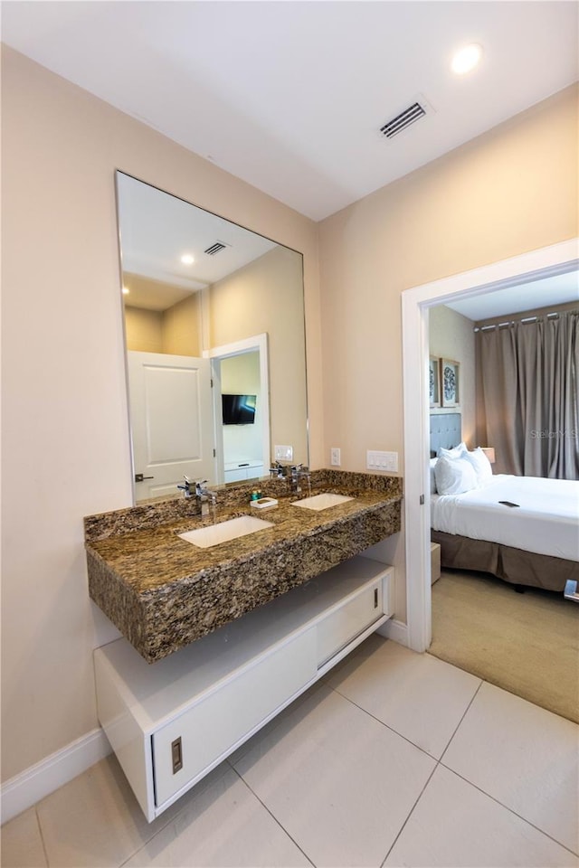 bathroom featuring vanity with extensive cabinet space and tile floors