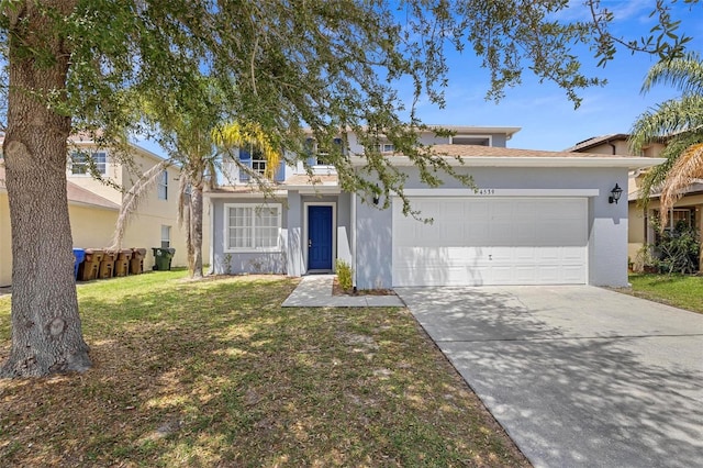 view of front facade with a garage and a front yard