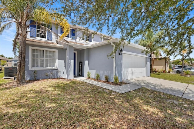 view of front of house with a front lawn, a garage, and central air condition unit