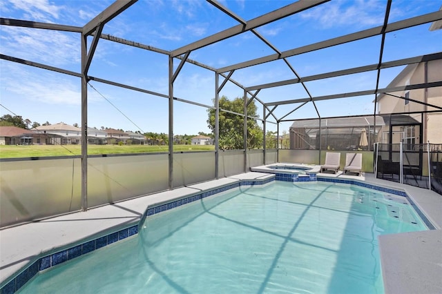 view of pool with a lanai and an in ground hot tub