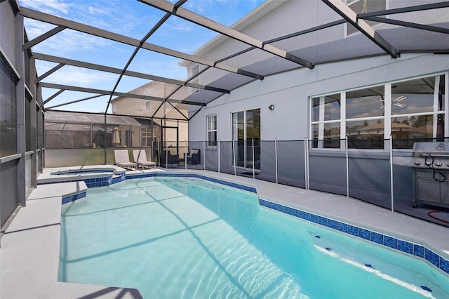 view of swimming pool with a patio, an in ground hot tub, and glass enclosure