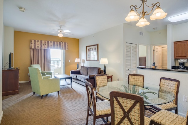 interior space featuring ceiling fan with notable chandelier