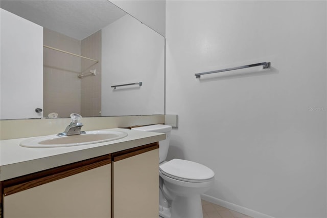 bathroom featuring vanity, toilet, and a shower