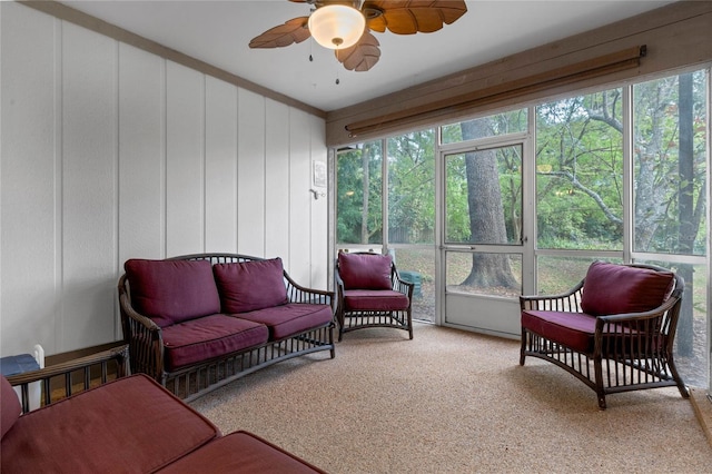 sunroom featuring ceiling fan