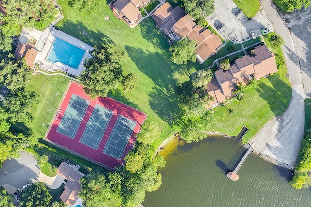 birds eye view of property with a water view