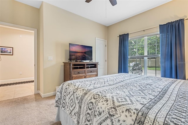 bedroom with light carpet and ceiling fan